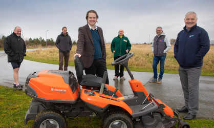 Lawnmower donation from Wales & West Housing helps community biking circuit