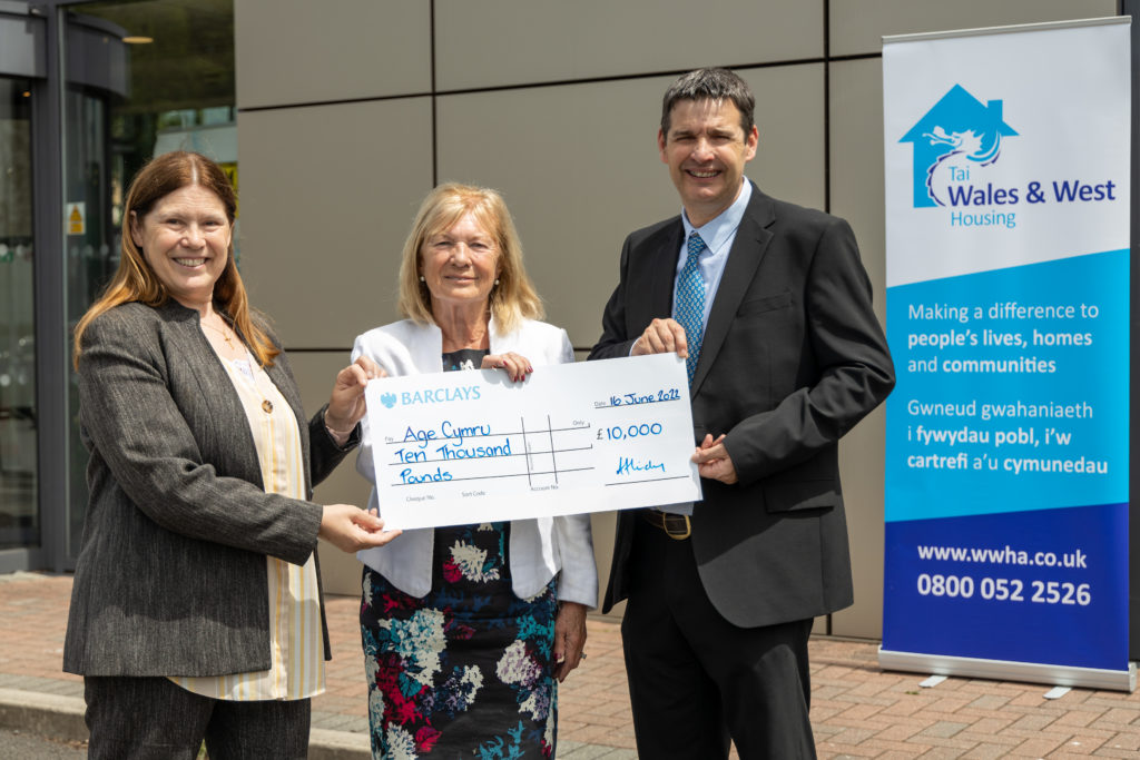 WWH GCE Anne Hinchey with Chair of the WWH Board Alex Ashton donating £10,000 cheque to Age Cymru