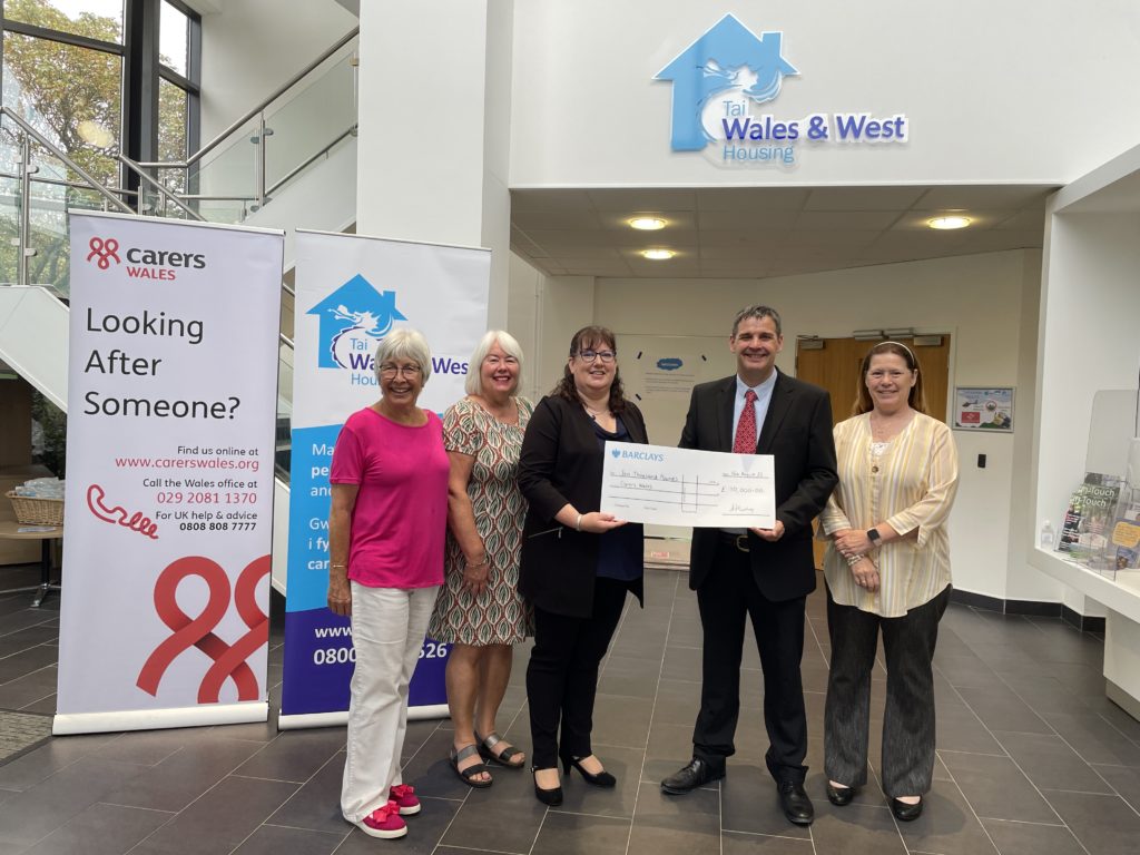 GCE Anne Hinchey and Chair of the WWH Board Alex Ashton present cheque to Carers Wales