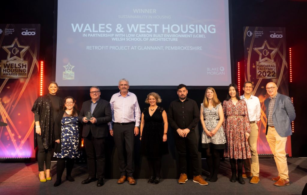 WWH retrofit team collecting award on stage