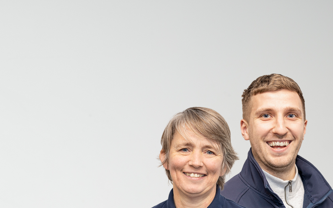 2 WWH staff members smiling to camera