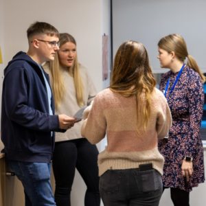 4 WWH staff in discussion in a trianing session