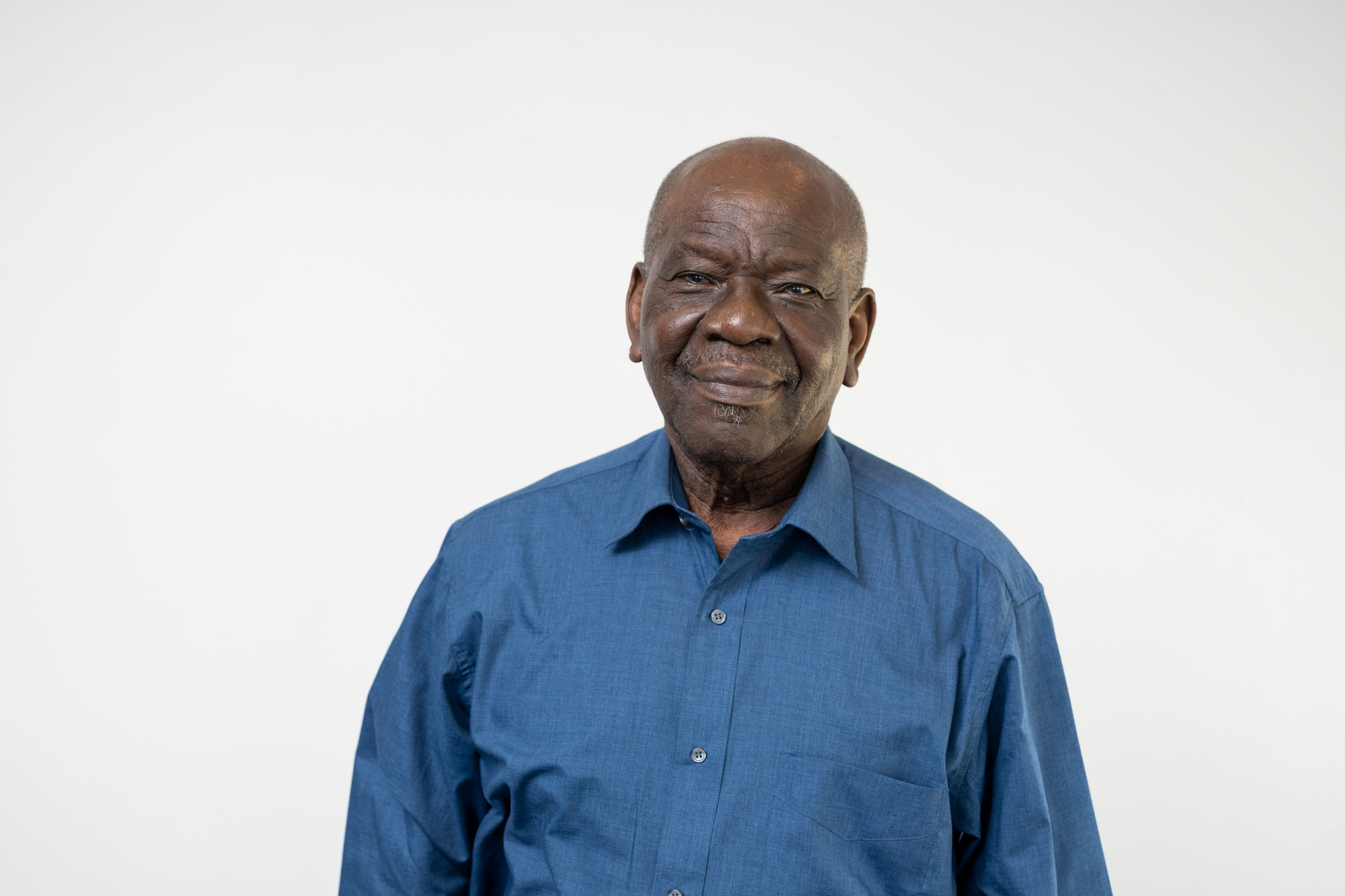 Board member Ivor Gittens smiling to camera