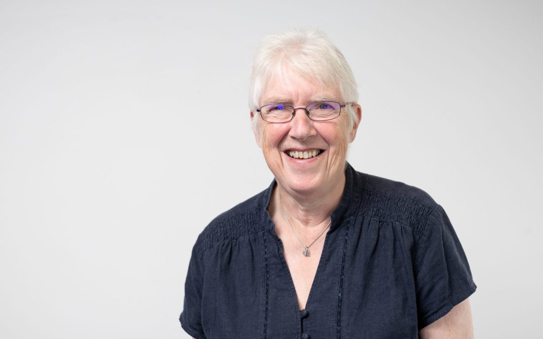 Board member Ruth Eley smiling to camera