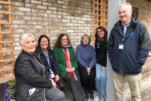 Residents and WWH staff in the garden at Pentland Close