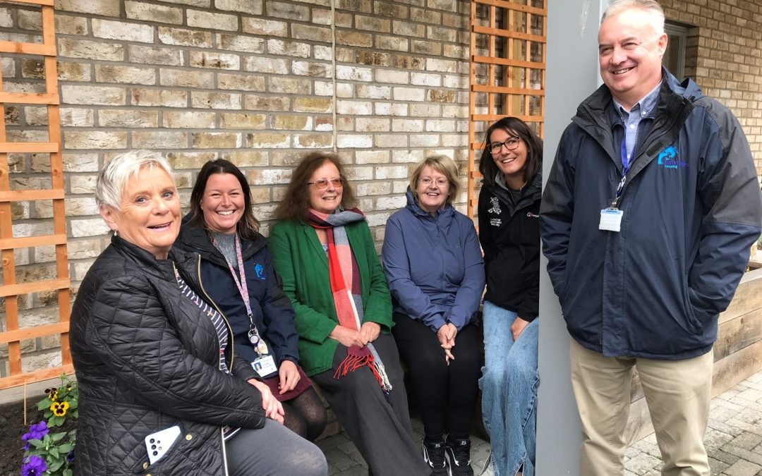 Residents and WWH staff in the garden at Pentland Close