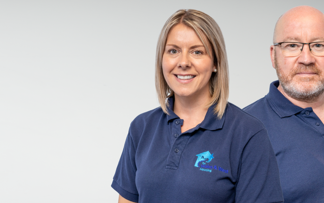 Two WWH staff members smiling to camera