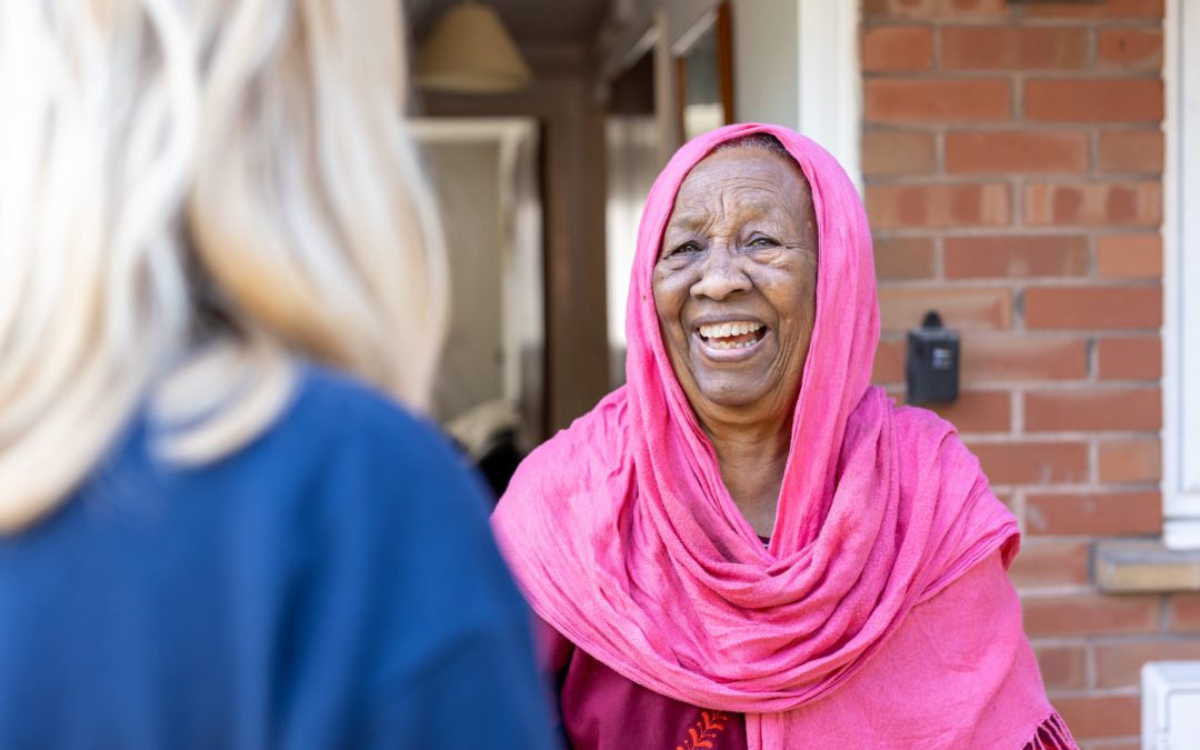 WWH resident laughing with Housing Officer
