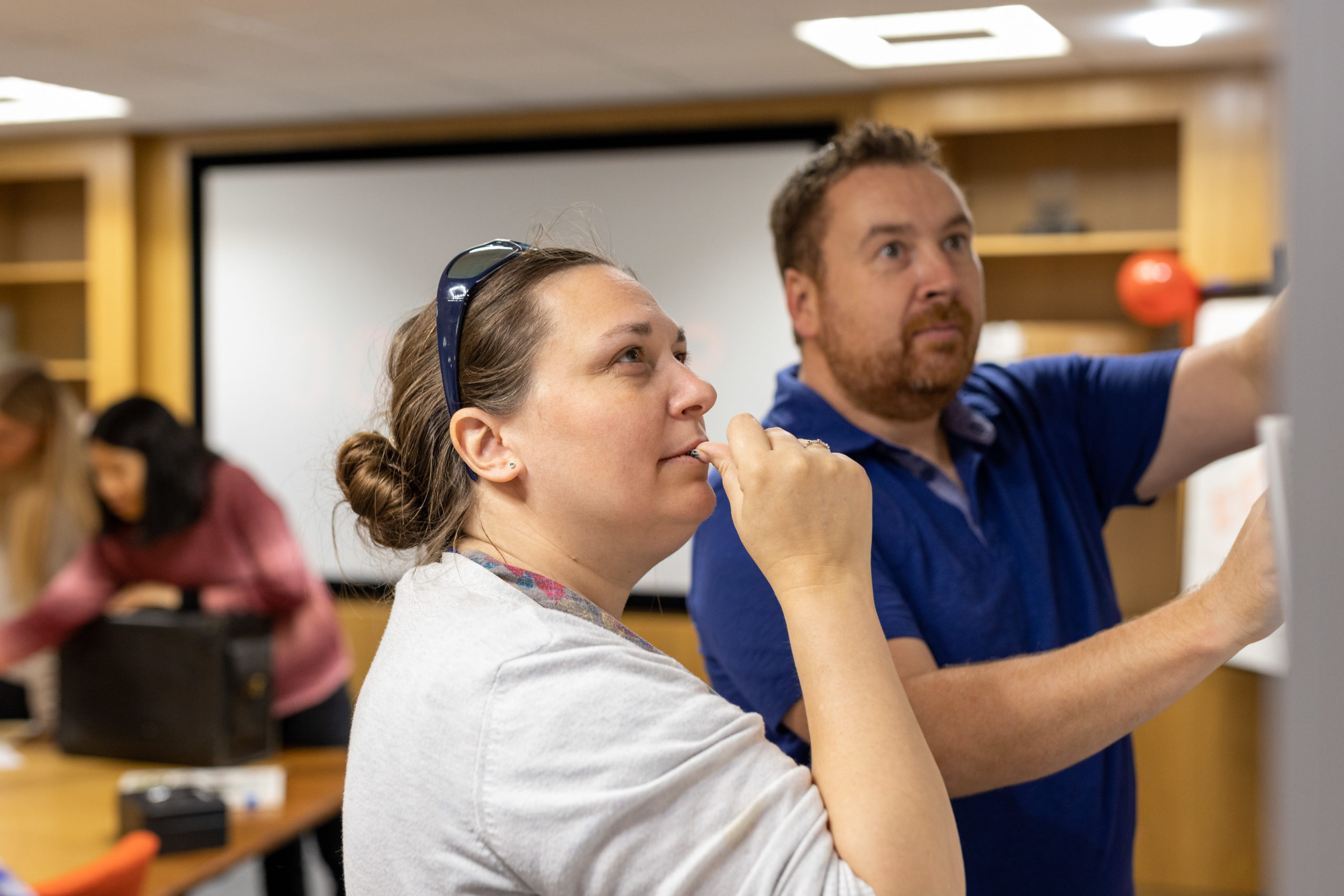 WWH staff working on a flip chart in training