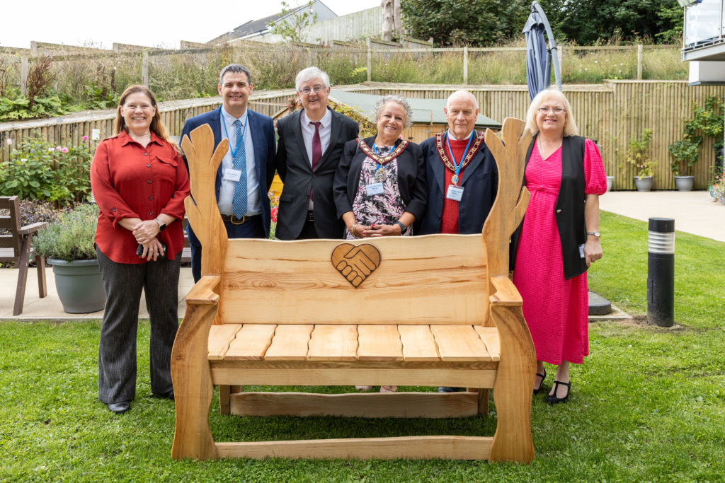 Bench unveiled by First Minister Mark Drakeford at Plas yr Ywen extra care scheme official opening