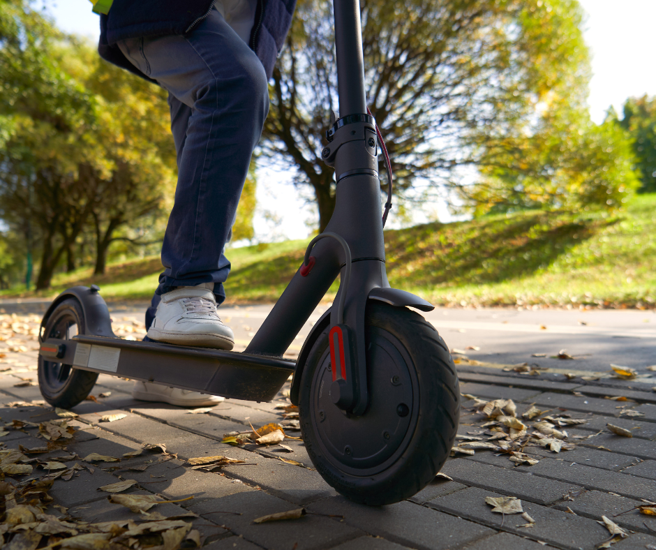 Person riding an e-scooter outside