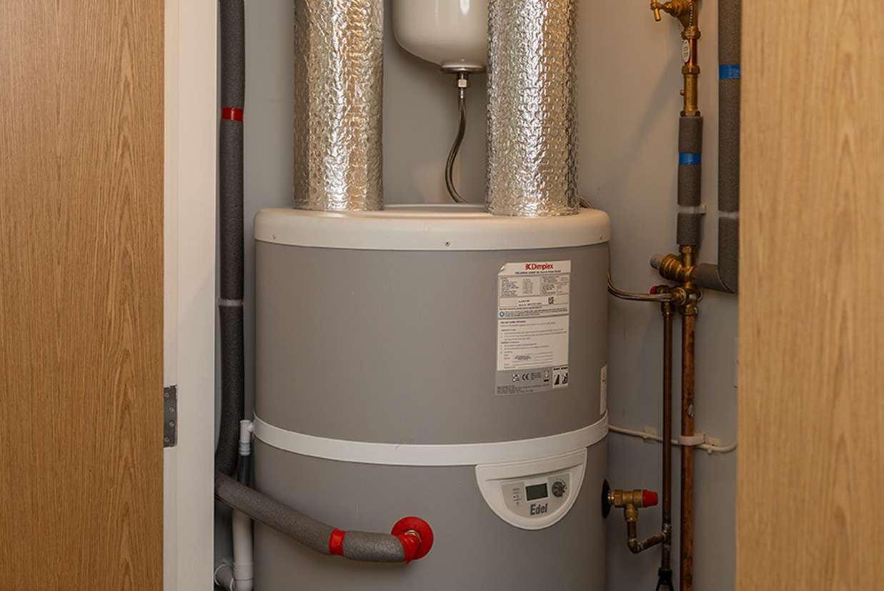 Image of an Air Source Heat Pump machine on the ext