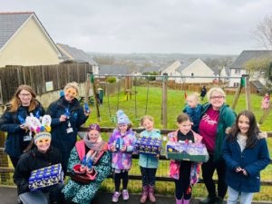 Group shot of people holding chocolate Easter eggs