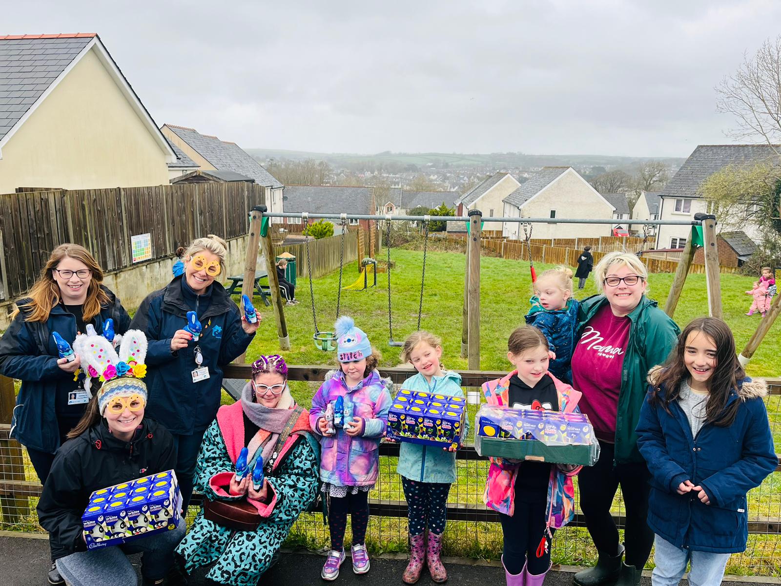 Group shot of people holding chocolate Easter eggs