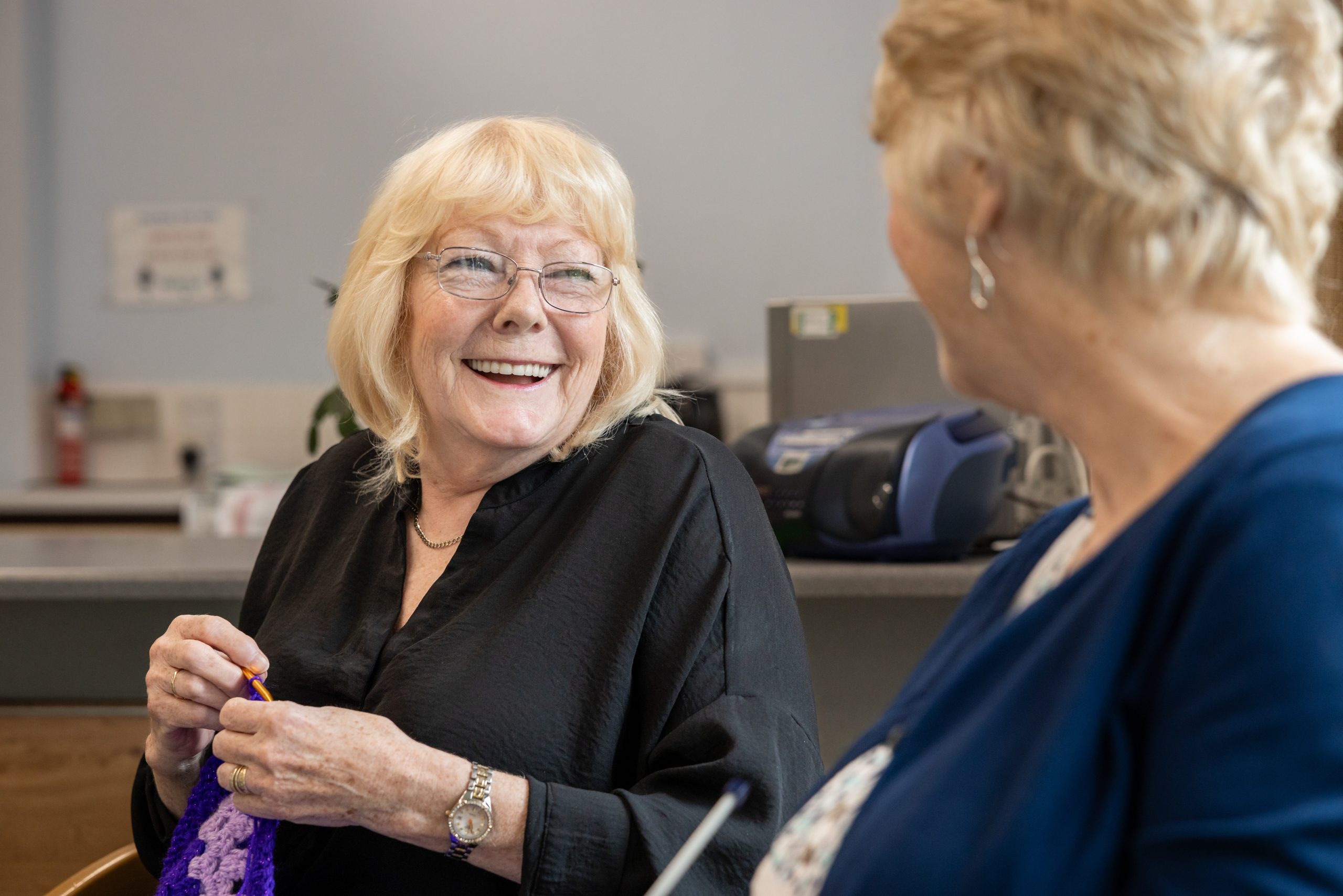 WWH resident laughing with Housing Officer
