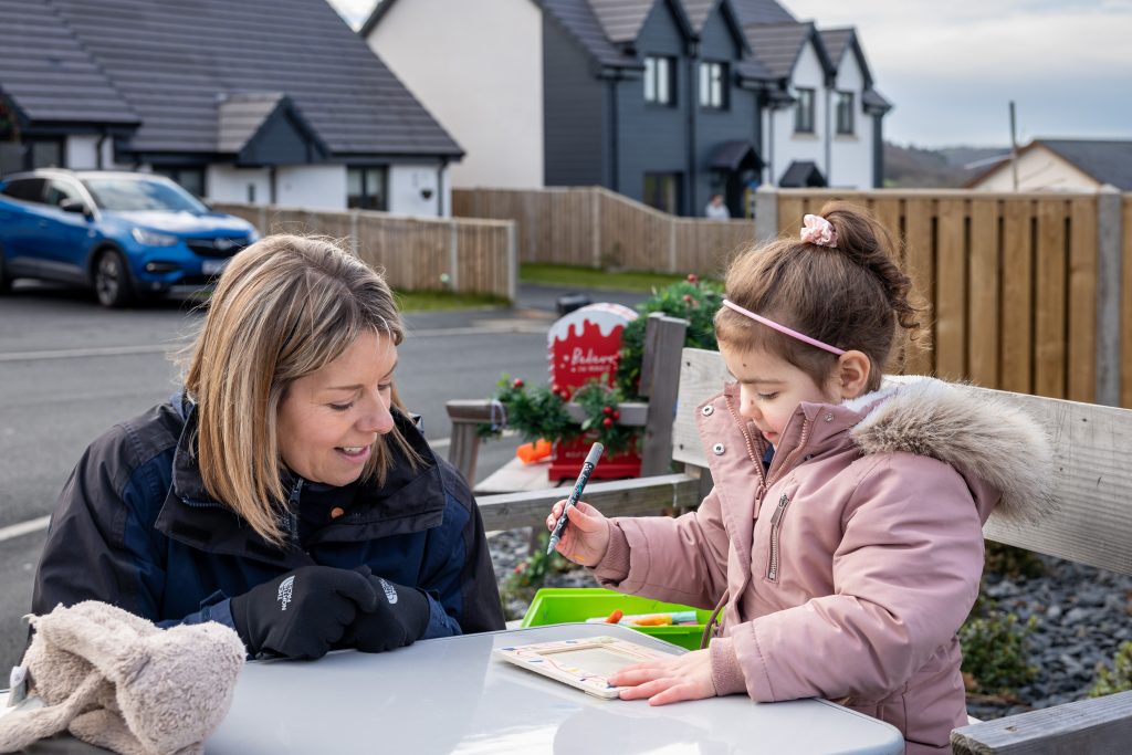 Image of staff member talking to residents