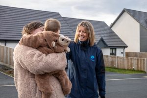 Image of staff member talking to residents.